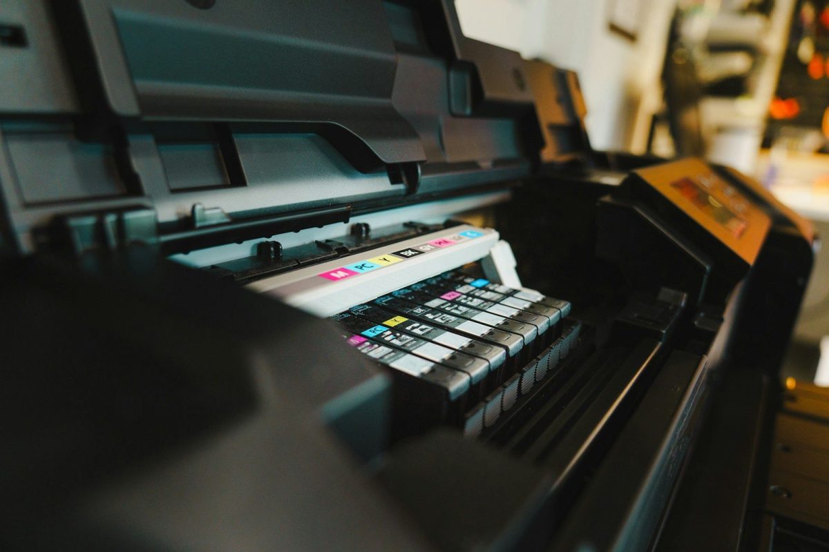 Custom Printing Trends Every Designer Should Know a close up of a printer on a table