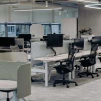 an office with a lot of desks and chairs
