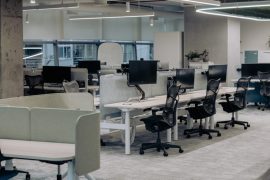 an office with a lot of desks and chairs
