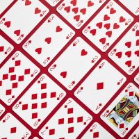A close up of a red and white table cloth