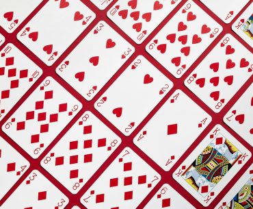 Solitaire.net: Mastering the Classic Card Game Online A close up of a red and white table cloth