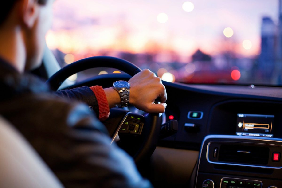 How Sales Territory Mapping Can Help Small Businesses Reduce Travel Time man driving a car wearing wrist watch