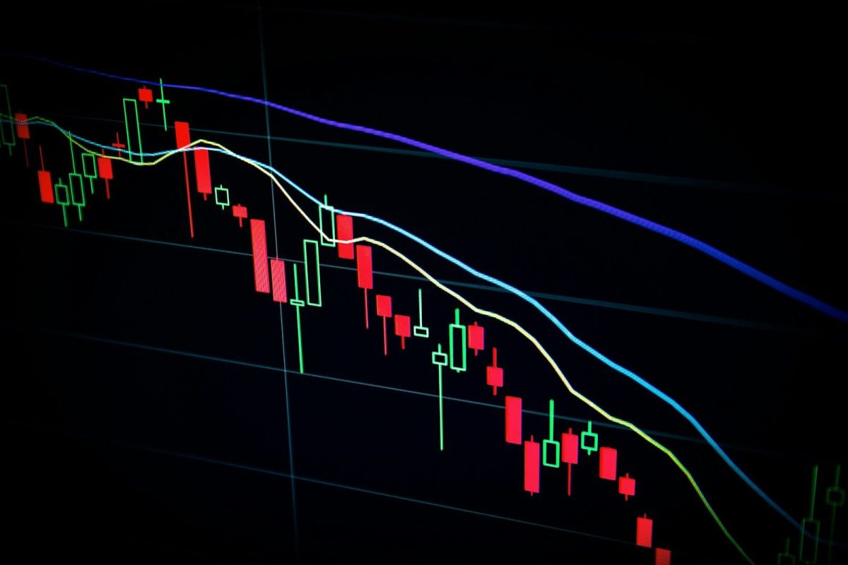 How to Compare Cryptocurrency Exchanges: The CryptoVantage Research Framework stock market candlestick chart on dark screen