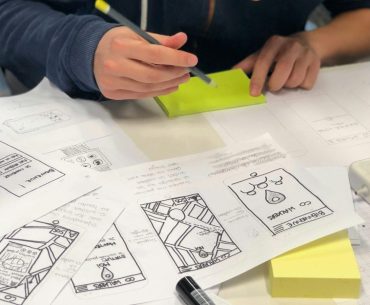 person writing on white paper