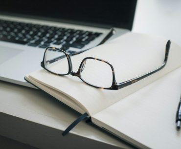 5 Highly Recommended Law Firms in Los Angeles black framed eyeglasses and black pen