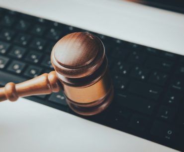 The CAD History Nobody Cleared: How Version Trees, PDM Logs, and Export Records Are Turning Design Files Into Federal Trade-Secret Evidence a wooden gaven sitting on top of a computer keyboard
