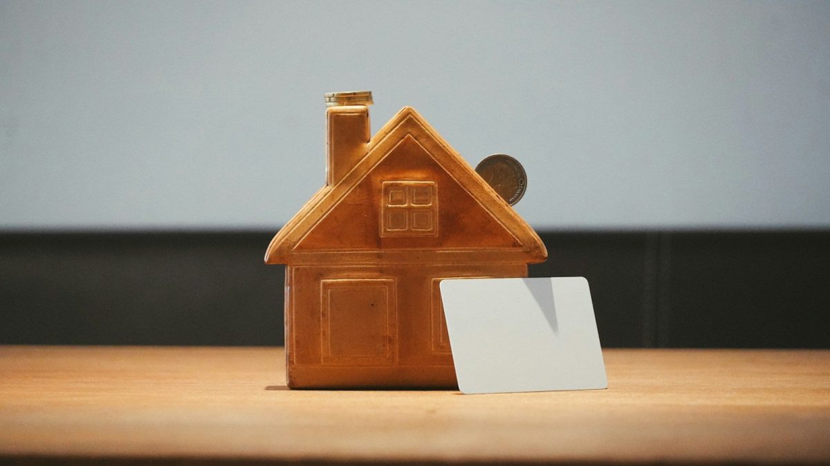 Designing a Home Workshop That Won’t Wreck Your Mortgage Appraisal A small house bank with a coin and blank card