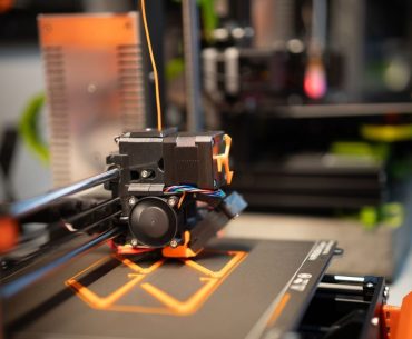 How 3D Printer Cloud Accounts Are Becoming Evidence in Ghost Gun and Restricted-Parts Cases Detailed view of a 3D printer head in action creating a design.